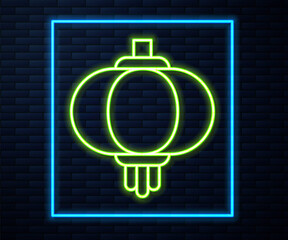 Glowing neon line Chinese paper lantern icon isolated on brick wall background. Vector
