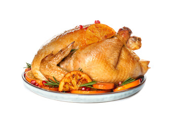 Roasted chicken with oranges, pomegranate and vegetables isolated on white