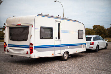 Camper parks in a parking. Tourist caravan.