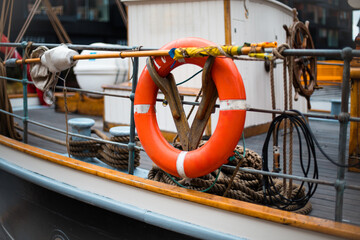Red rescue tire on the boat.