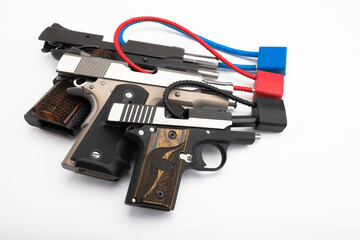 Gun safety , Locked disarmed and secured automatic guns on white background