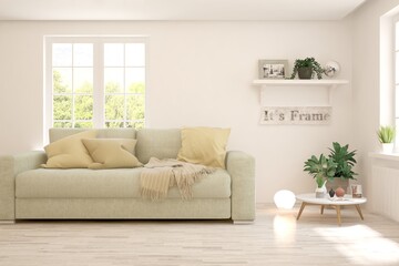 Fototapeta premium White living room with sofa and summer landscape in window. Scandinavian interior design. 3D illustration