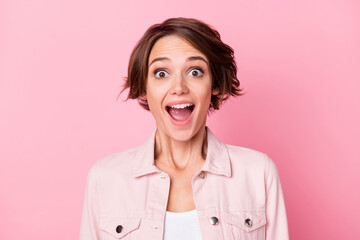 Photo of amazed charming young lady shocked discount news reaction isolated on pastel pink color background