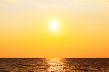 Sundown over the sea . Follow the sun . Sun over the open sea in the evening 