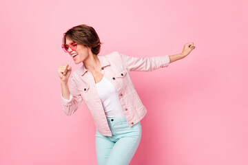 Photo of funky crazy charming girl closed eyes sing song good mood isolated on pastel pink color...