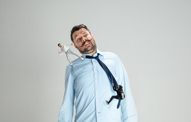 Human issues - angel and demon characters on adult man. Dark and light side of everyone.