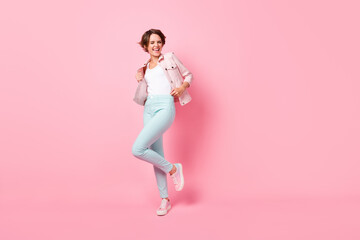 Fototapeta na wymiar Full size photo of young pretty charming excited crazy girl smiling dancing enjoying free time isolated on pink color background