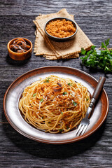 Pasta mollicata with anchovies, top view, close-up