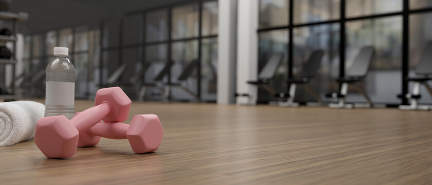 3D rendering, pink dumbbells on wooden table with sport stuffs in concept fitness room with training equipments in the back