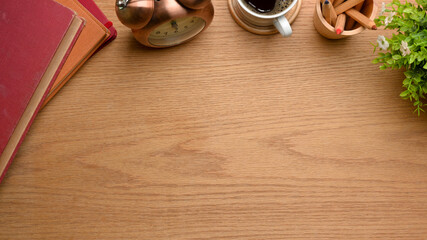Creative mock up scene with copy space, books, clock, cup, pencils and plant pot