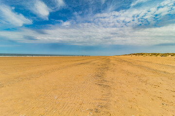 Fototapeta na wymiar Walking on the beach in england, Holkland Beach North Sea