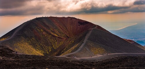 Colorful craters of Mt. Etna - the highest active volcano in Europe. Dramatic sky 