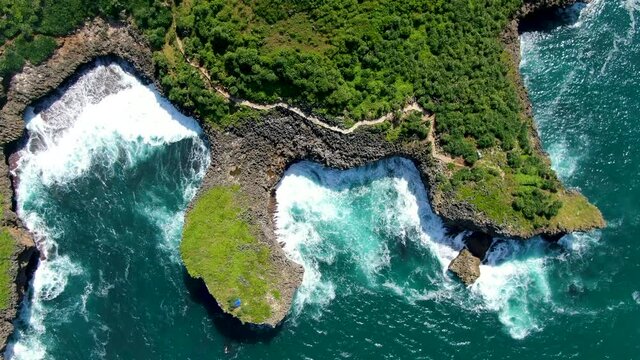 Majestic cliff shoreline of Java, Indonesia, Kesirat Beach aerial top view