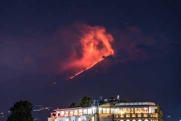 Fire and lava flow during a massive eruption of Mt Etna at nighttime - the highest active volcano...