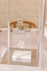 Festive Floral decor on wedding banquet tables in white colors with cutlery