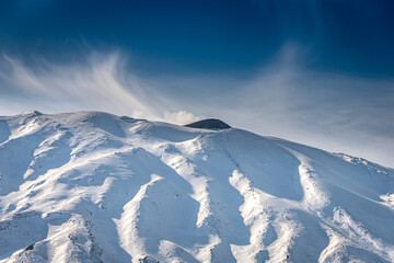 The snowy peak pf Mt Etna. Winter scenery 