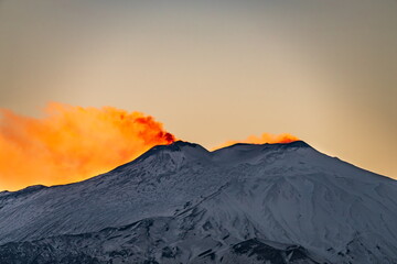 Red glow on the top of Mt Etna during sunset 