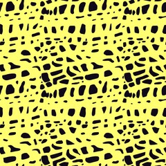Seamless graphic abstract pattern of black shapes, spots on a yellow background, print textile