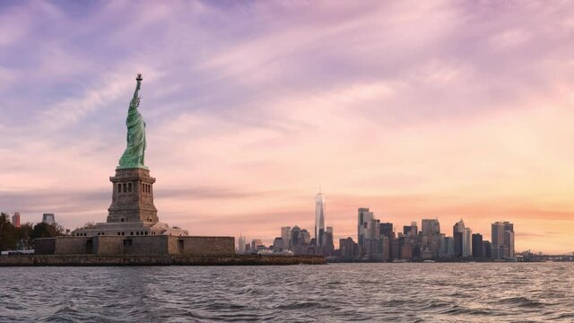Cinemagraph Seamless Continuous Loop Animation. Statue of Liberty and Downtown Manhattan in the background. Dramatic Colorful Sunrise Artistic Render. Taken in Jersey City, New Jersey, United States.