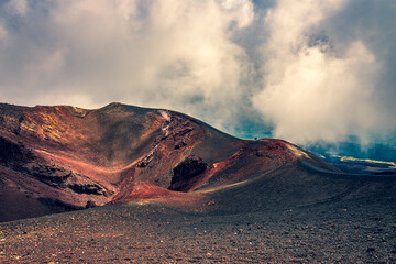 Volcanic landscape, dramatic sky. Craters at Mt Etna- the highest active volcano in Europe 
