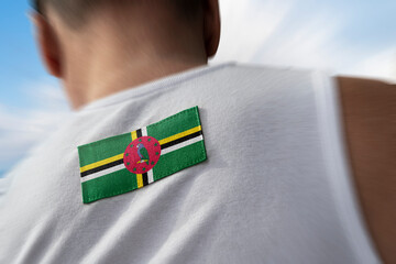 The national flag of Dominica on the athlete's back