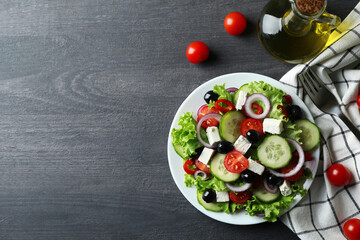 Plate of greek salad on dark wooden background