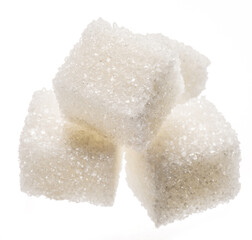 White sugar cubes on white background. Macro picture.