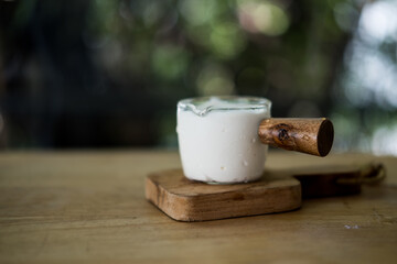 Whipped cream in small glass cup