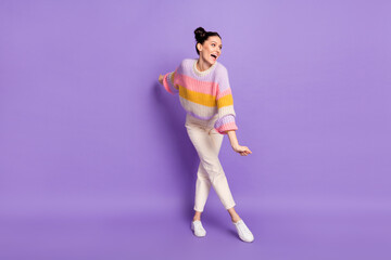 Full length body size view of attractive thin carefree cheerful girl having fun dancing isolated on bright violet purple color background