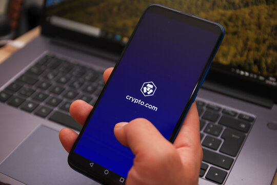 Berlin, Germany - April 22, 2021: Crypto.com (MCO) cryptocurrency logo displayed on smartphone. Crypto.com is a cryptocurrency and payment platform.