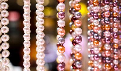 Pearl beads on a pink counter