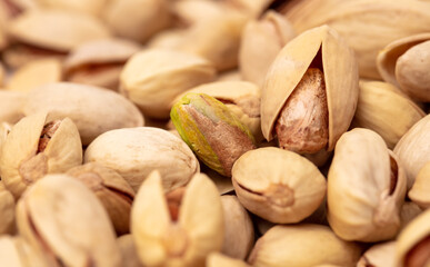 Close-up of fresh pistachio nuts as background.