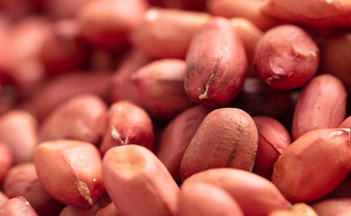 Close up of peanut nuts as background. Macro
