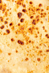 Fried pancake as an abstract background.