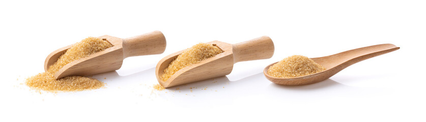 brown sugar in wood scoop and spoon  isolated on white