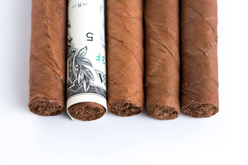 Rolled Cash and Cuban cigar stock photoSmoking cost concept. Cigarettes in euros and Dollers  background. 3d illustration stock photo