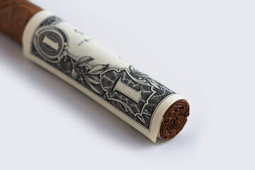 Rolled Cash and Cuban cigar stock photoSmoking cost concept. Cigarettes in euros and Dollers  background. 3d illustration stock photo
