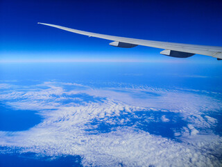 Fototapeta na wymiar Airplane wing over the Black Sea