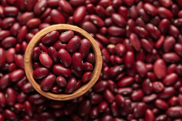 Macro Close up of Organic Rajma,  (Laal Lobia ) or red kidney beans dal in an earthen clay pot (kulhar) on the self background. Top view