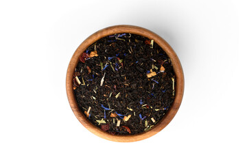 Black tea with rosehip and apple in wooden bowl isolated on white background.