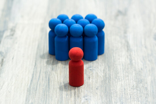 A Manager or Leader standing up for his team of co workers stock photo