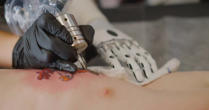 The woman with the bionic prosthesis in hand is working on the tattoo Bionics Cybernetic Robotic-arm Hand prosthesis
