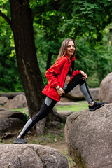 young girl stretches in the park