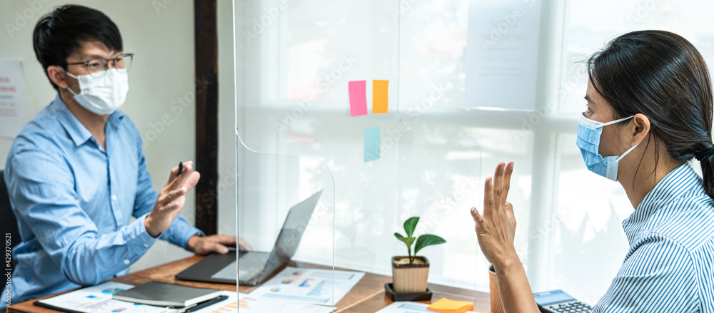 Poster two business colleagues wearing face mask to brainstorming business project and giving high five to 