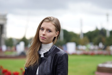 Portrait of a young beautiful girl in the park