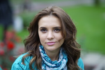 Portrait of a young beautiful girl in the park