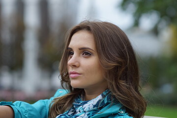 Naklejka premium Portrait of a young beautiful girl in the park