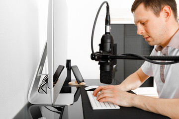 male bloggers recording video blog or music vlog at home. Blogging, music, creation.