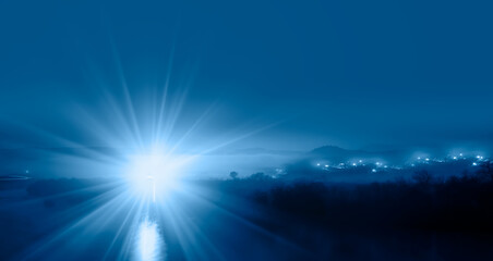 Night sky in the clouds with lighthouse 