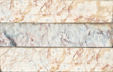Texture of red, black and white marble. Stone tile with natural pattern. Marble pavement closeup.
